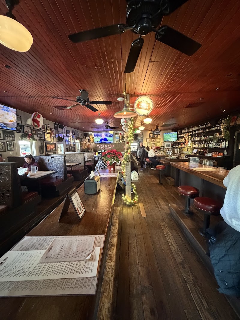 Warm wood-paneled bar room
