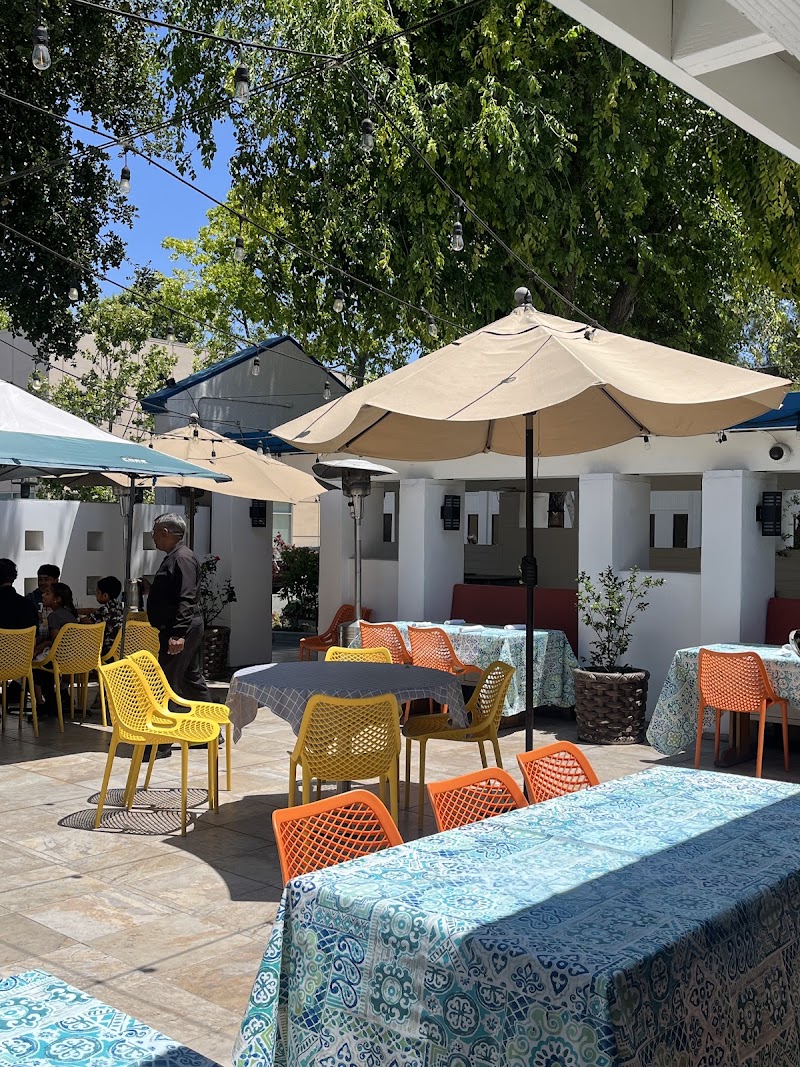 Sunny patio with colourful chairs