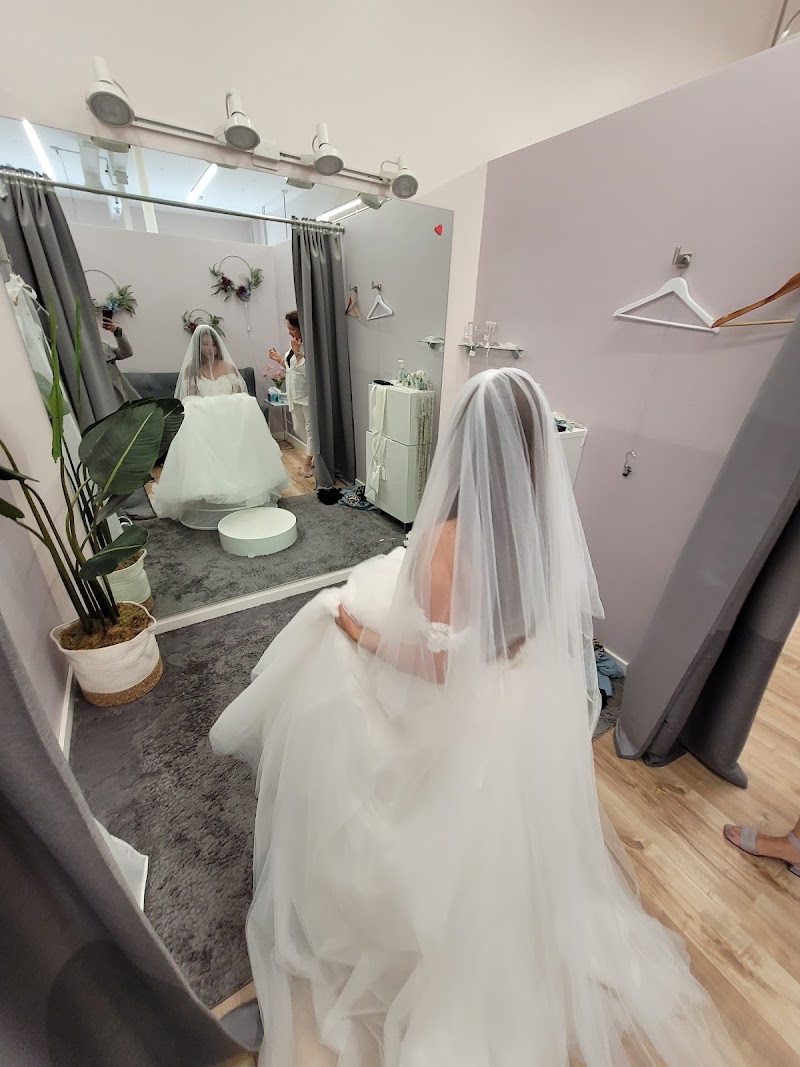Bride reflects, veil flowing