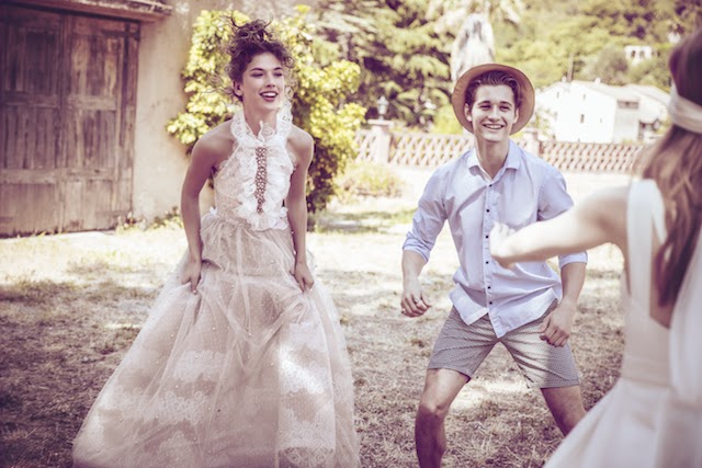Joyful bride dancing outdoors