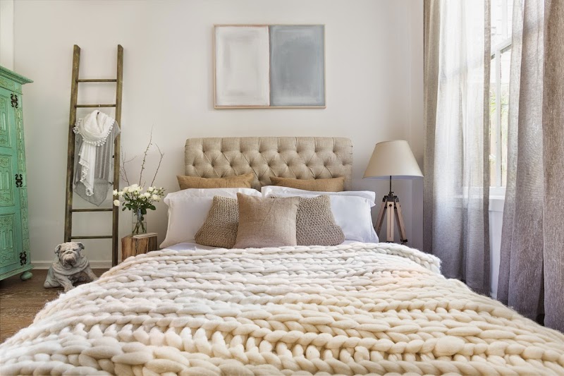 Cozy, layered bedroom styling