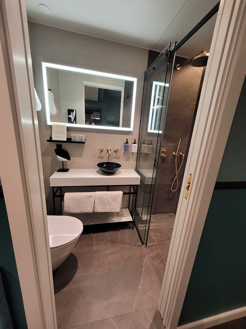 Refined bathroom with gold fixtures