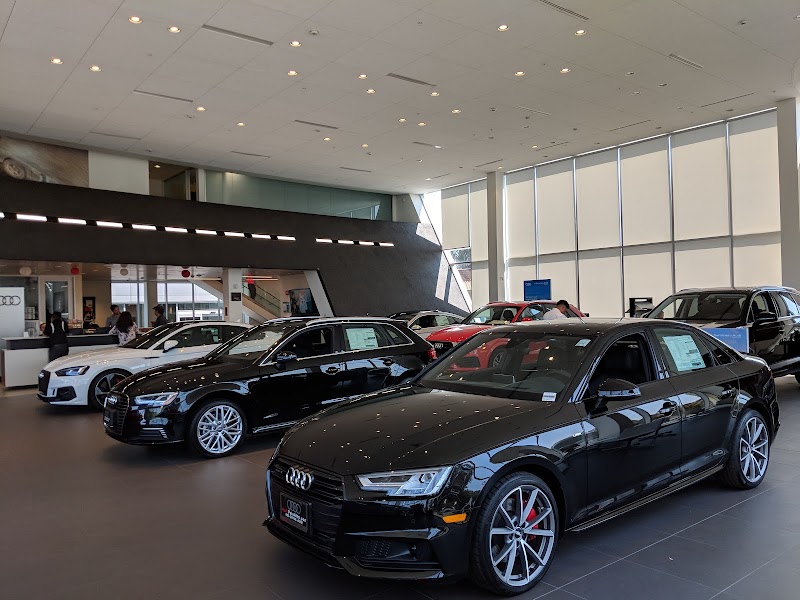 Bright showroom, sedans displayed