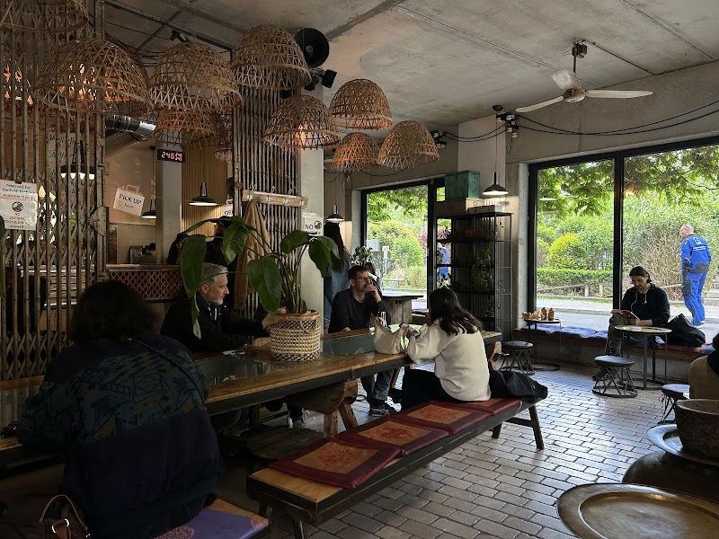 Wicker lamps, communal tables, full house