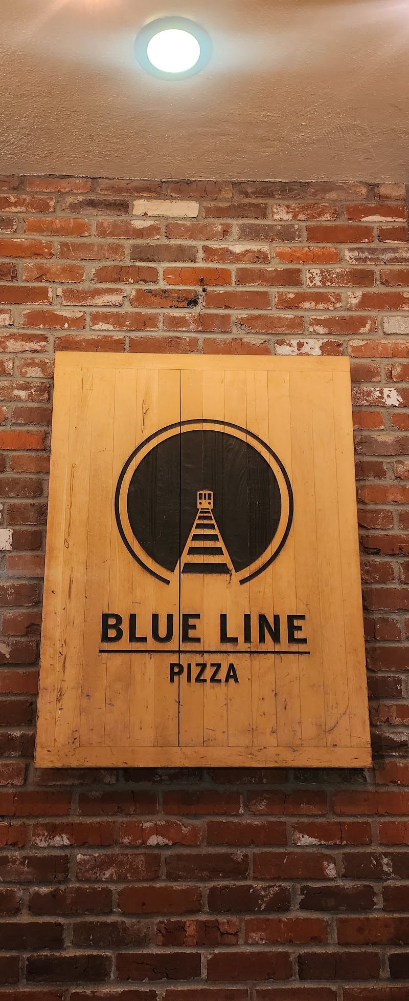 Rustic brick logo wall