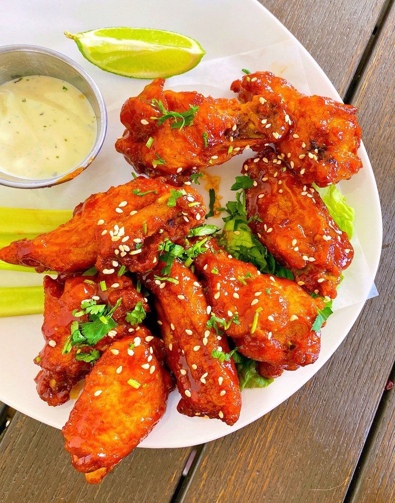 Saucy wings, fresh herbs