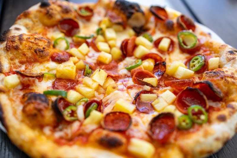 Wood-fired pepperoni pineapple pizza