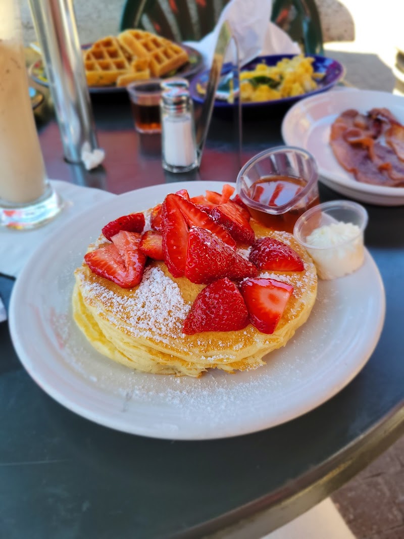 Fresh strawberry pancakes outdoors