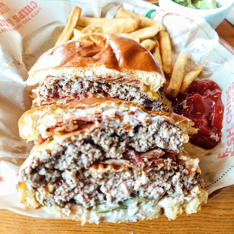 Hearty burger, fries alongside