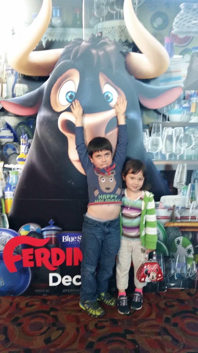 Kids pose with movie display