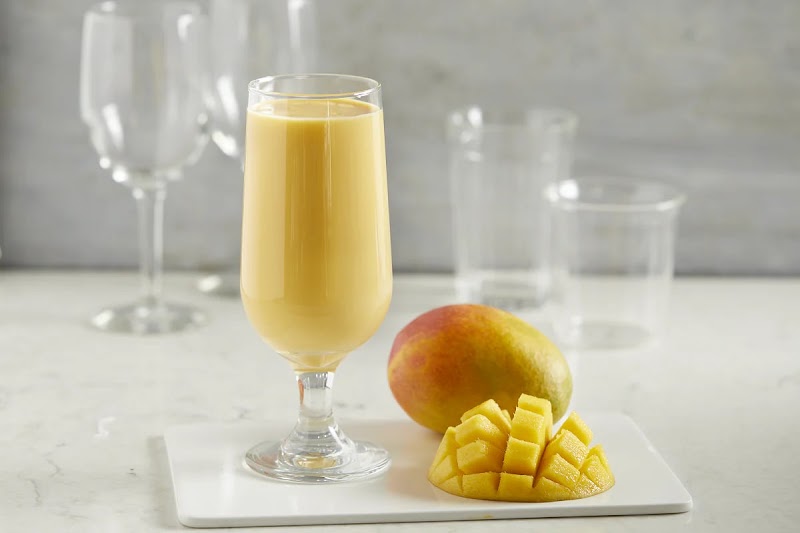 Chilled mango lassi poured