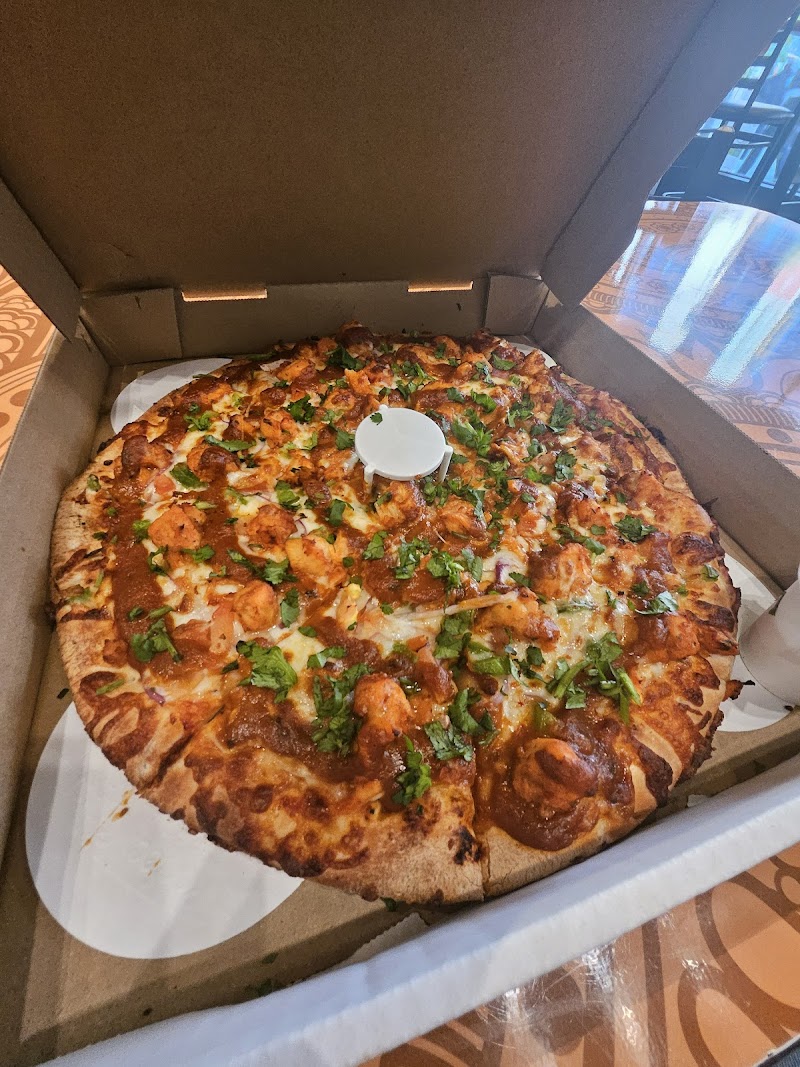 Butter chicken pizza, fresh-topped