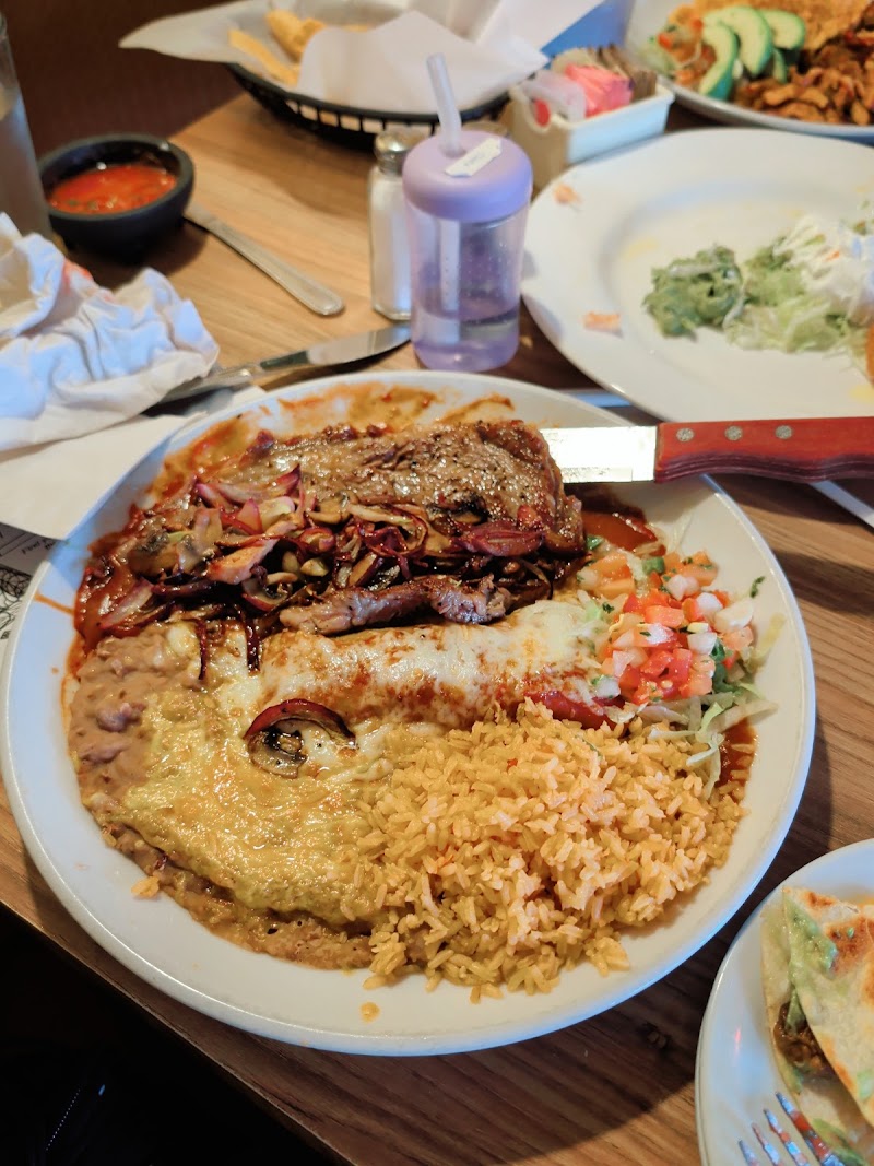 Hearty steak and enchilada plate