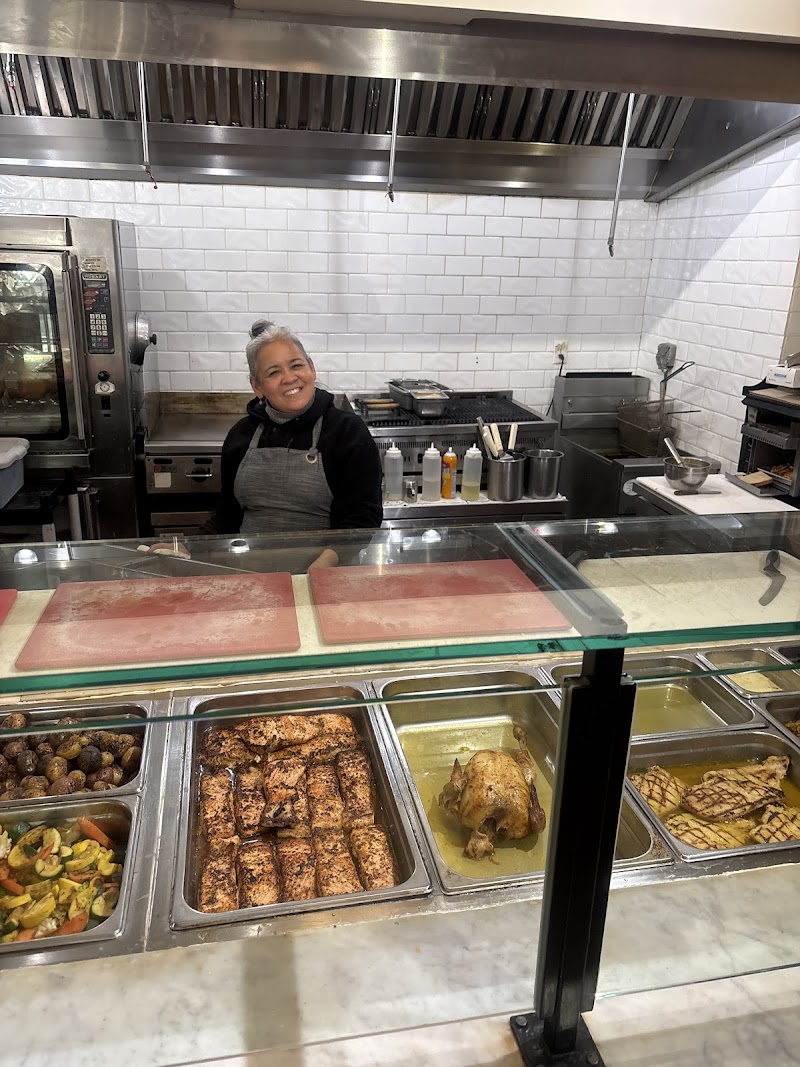 Smiling chef, fresh hot counter