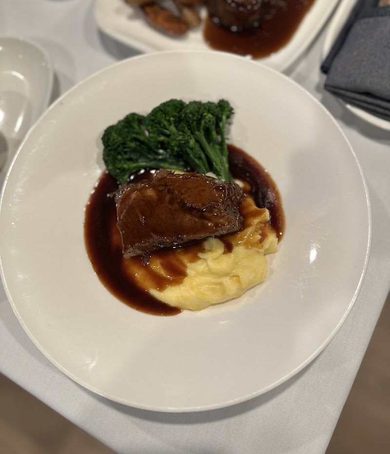 Braised beef over creamy mash