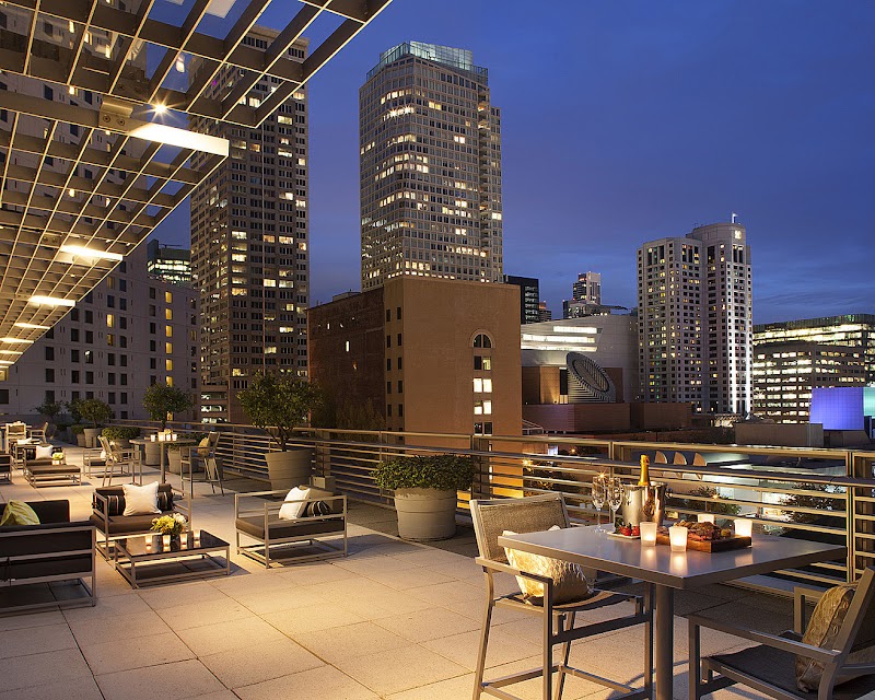 Terrace dining under city lights