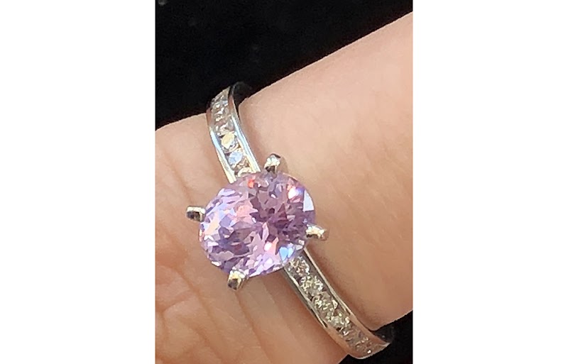Pink sapphire ring on hand
