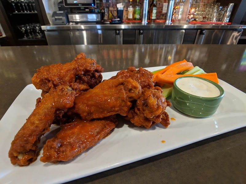 Saucy wings at the bar