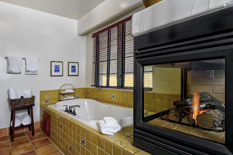 Soaking tub by fireplace