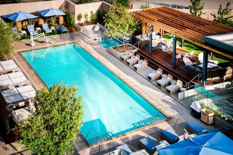 Sunlit pool with lounge seating
