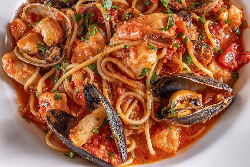 Hearty seafood pasta, tomato broth