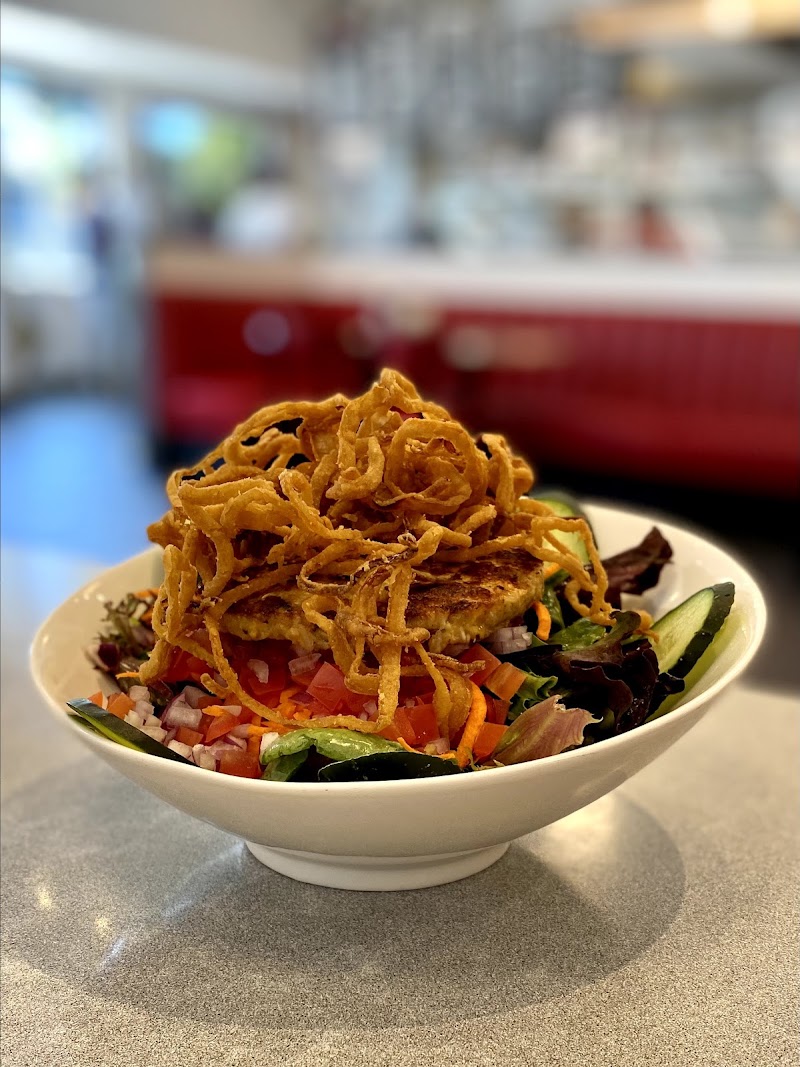 Hearty salad with burger