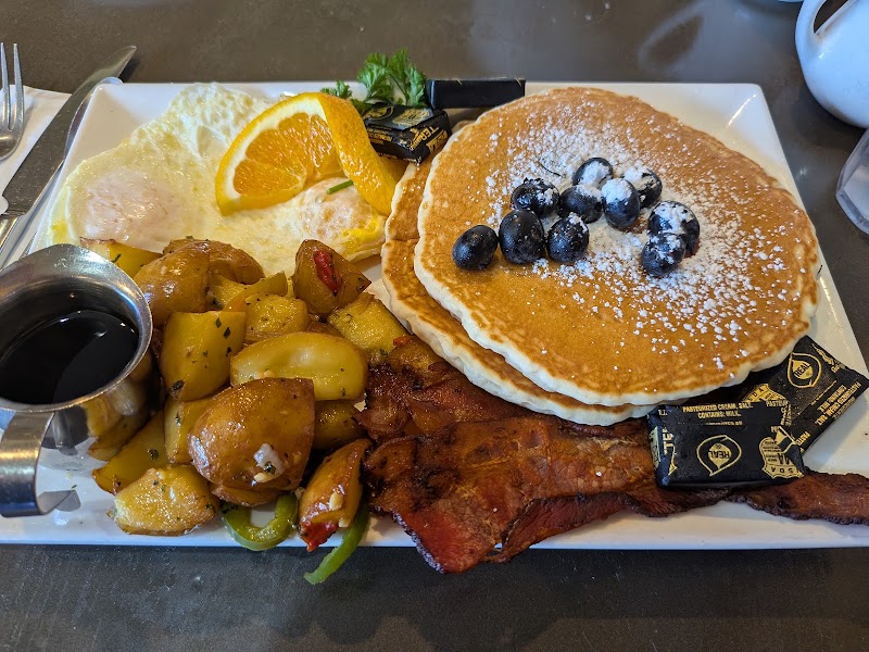 Blueberry pancakes, bacon, home fries