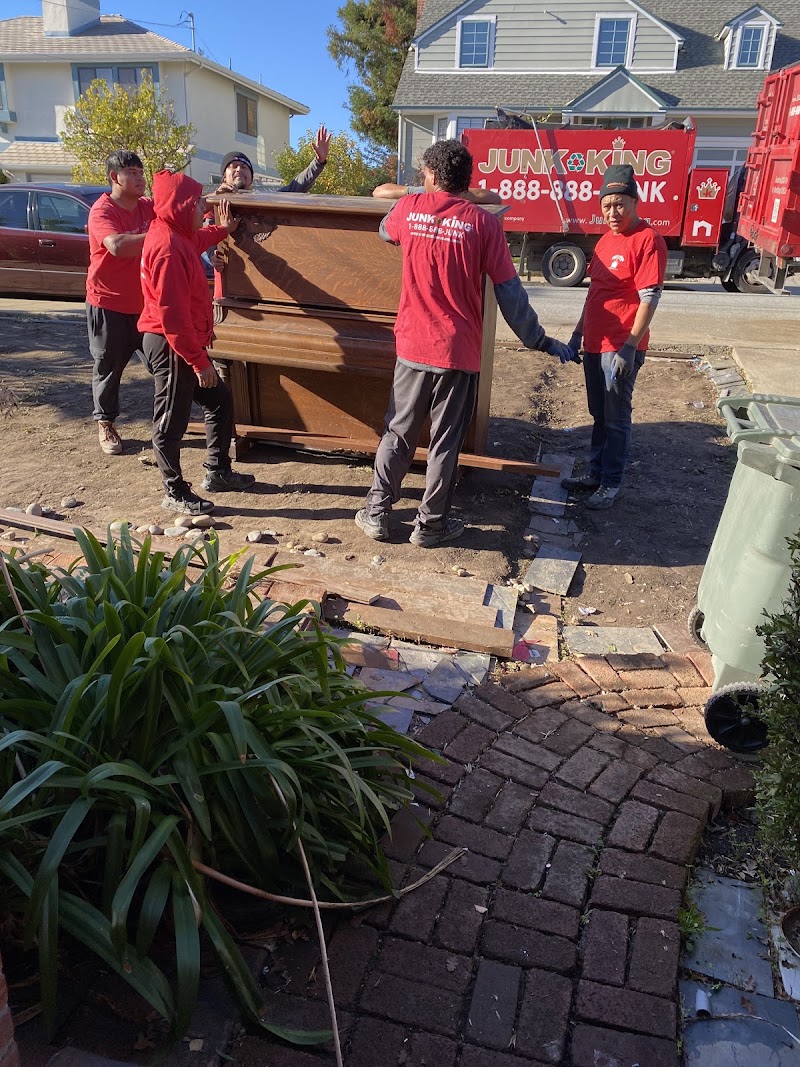 Team lifts heavy piano out