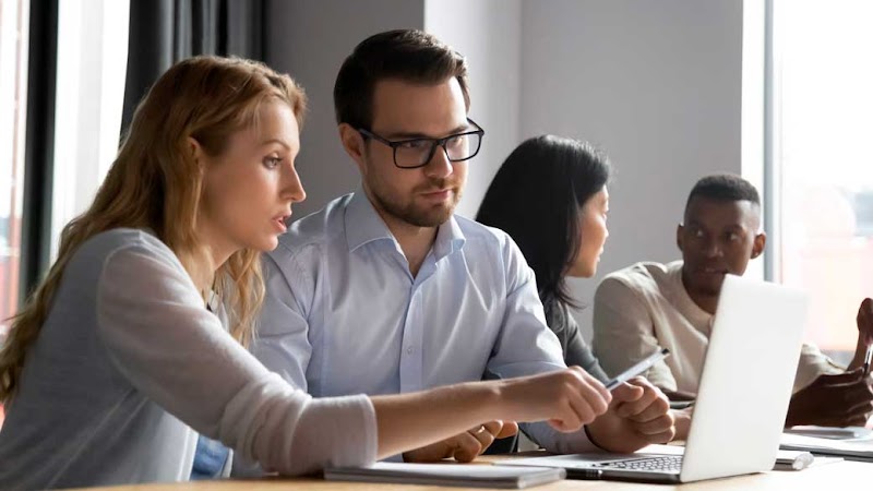 Colleagues collaborate on shared work