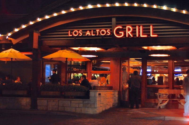 Glowing patio, bustling evening