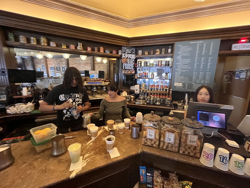 Friendly baristas crafting your drinks