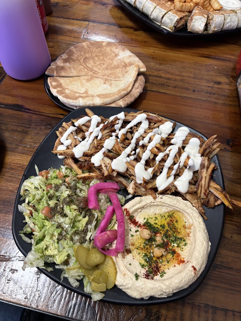 Shawerma plate, pickles and hummus