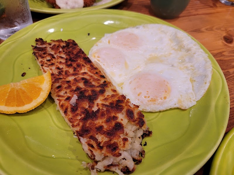 Golden hash browns, sunny eggs