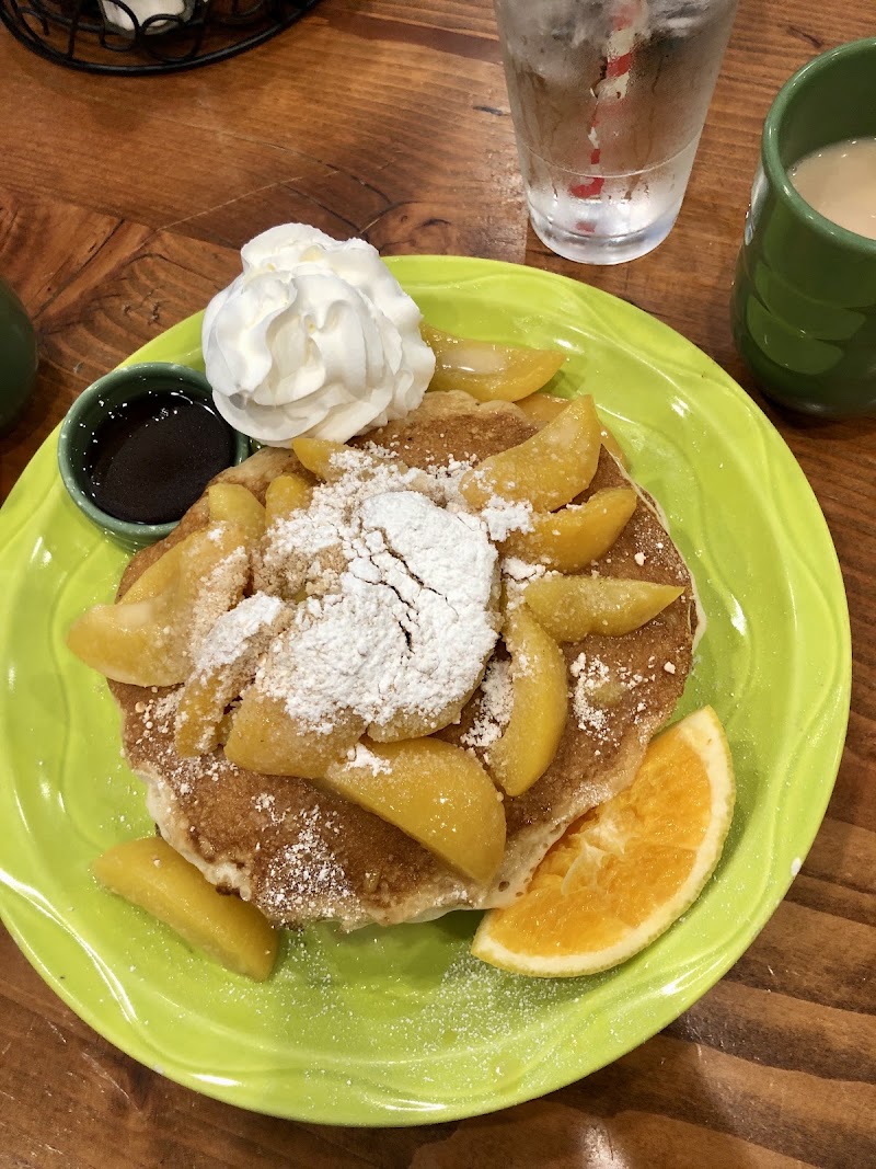 Pancakes piled with caramelized peaches