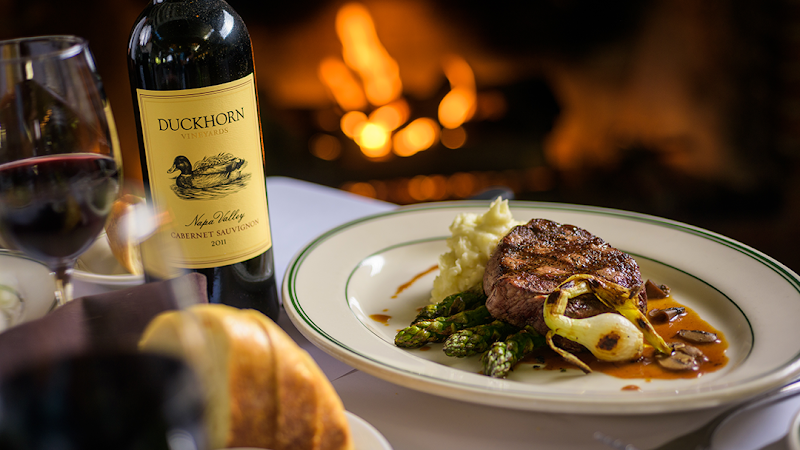 Steak and wine by firelight