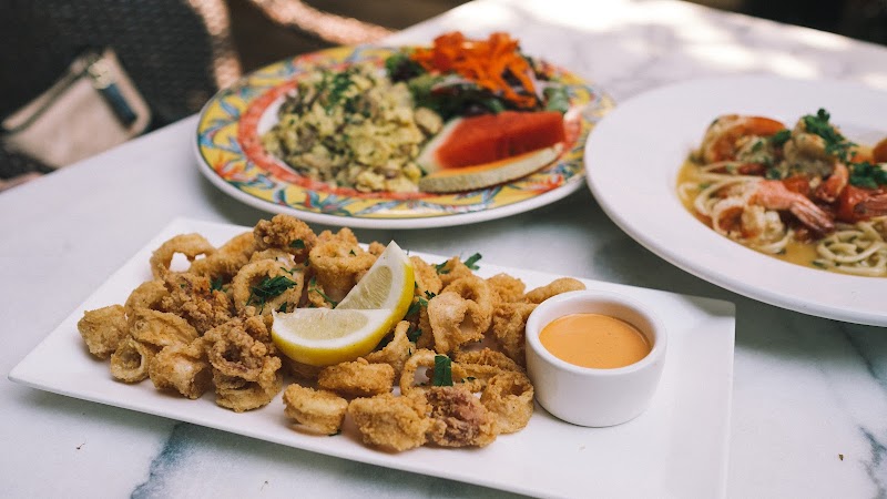 Calamari, pasta, colorful spread