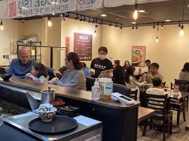 Busy ramen restaurant dining