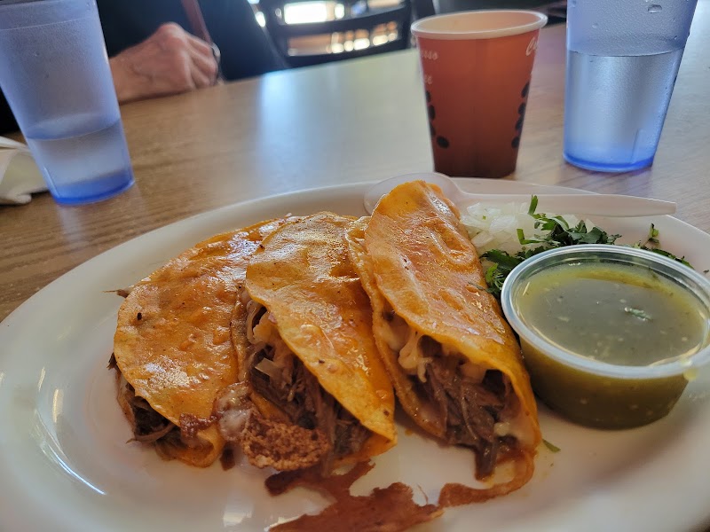 Loaded birria tacos plated