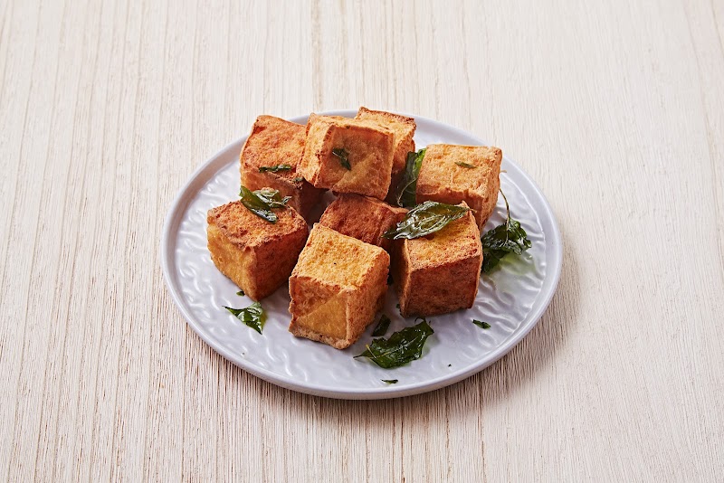 Fried tofu, basil garnish