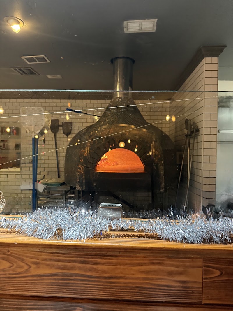 Wood-fired oven glowing inside