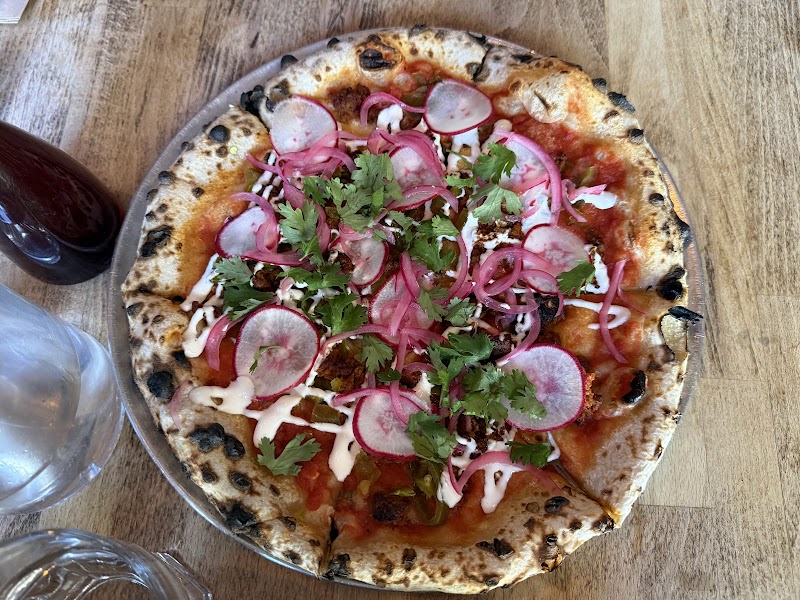 Wood-fired pizza, charred crust