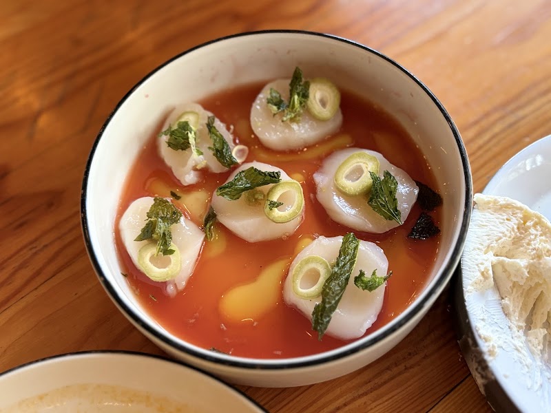 Delicate scallop carpaccio dish
