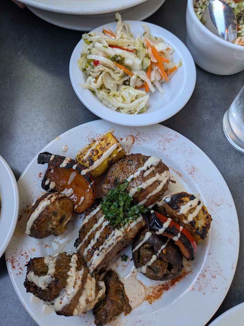Grilled meats, vibrant sides