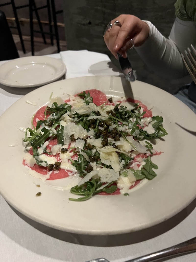 Carpaccio with arugula, shaved parmesan