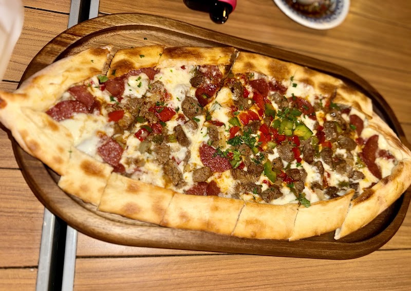 Loaded Mediterranean flatbread pizza