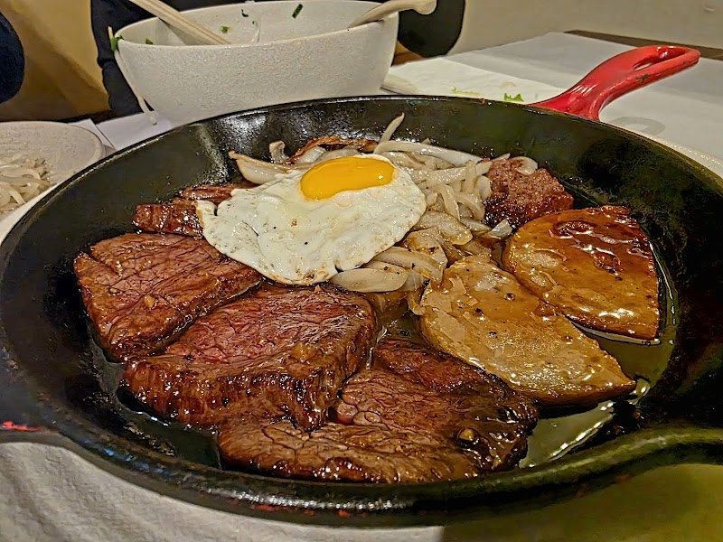 Sizzling beef on cast iron