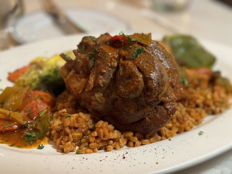 Slow-braised lamb over bulgur