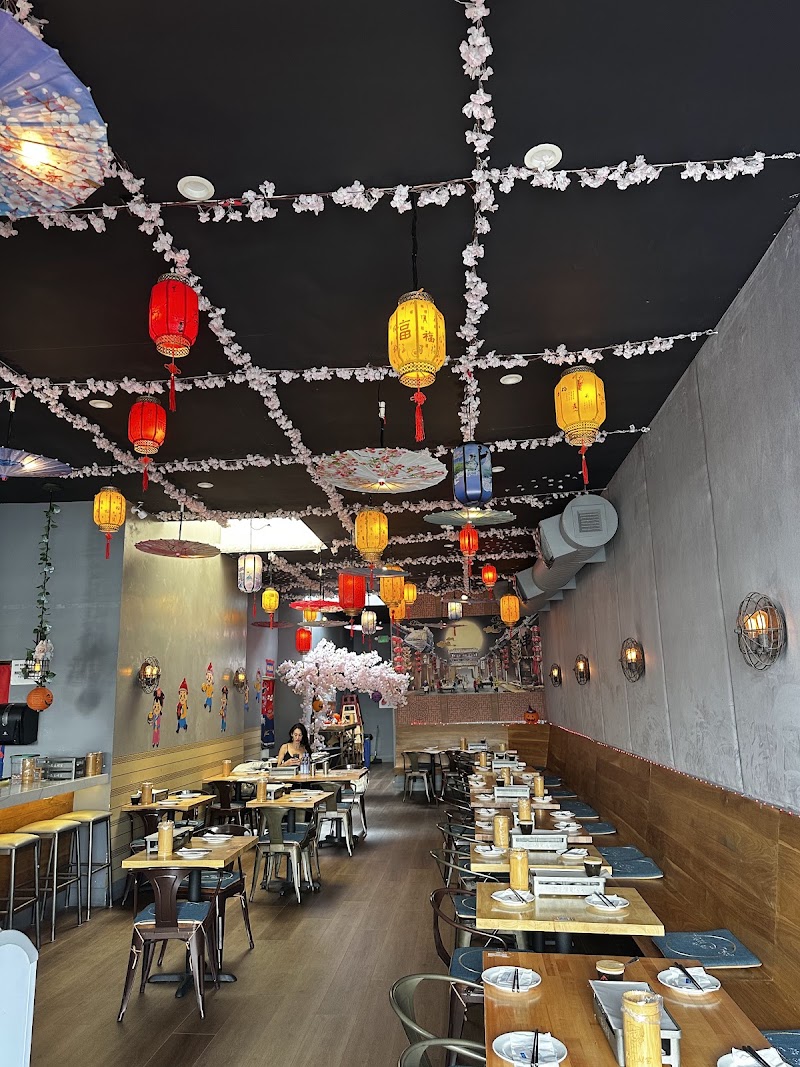 Warm lanterns fill ceiling