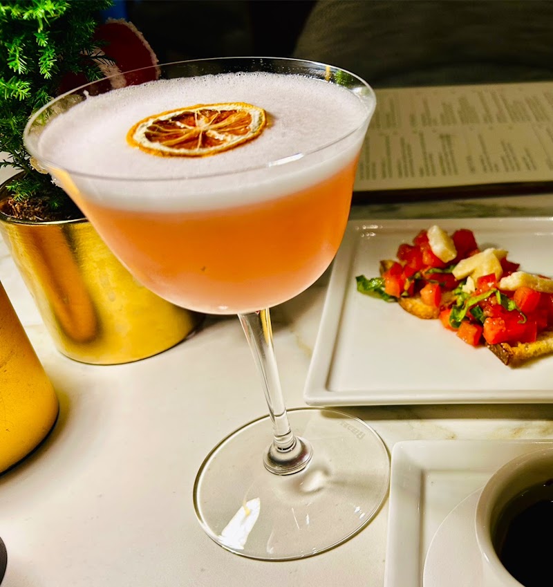 Handcrafted cocktail, fresh bruschetta