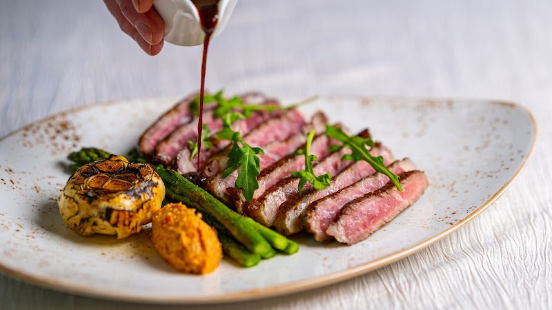 Sliced steak, sauce poured
